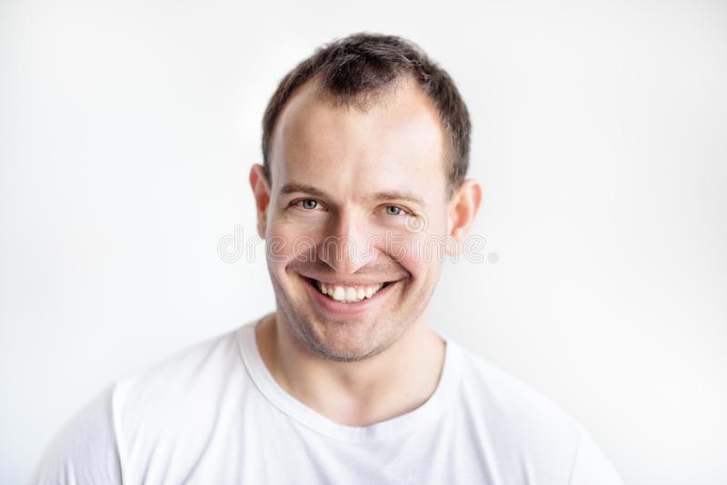 Closeup portrait smiling years old caucasian white man background t shirt confident happy smar