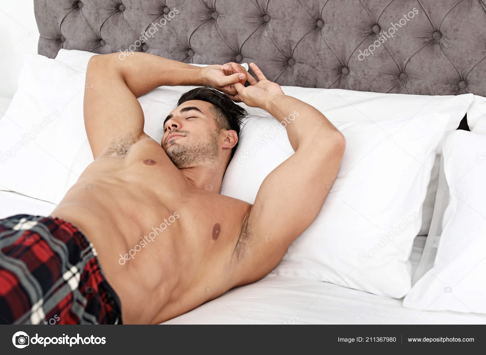 Depositphotos 211367980 stock photo sexy young man sleeping bed