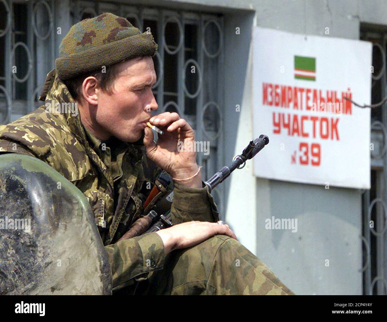 A russian soldier guards a polling booth in grozny march 25 russian soldiers beefed up securit