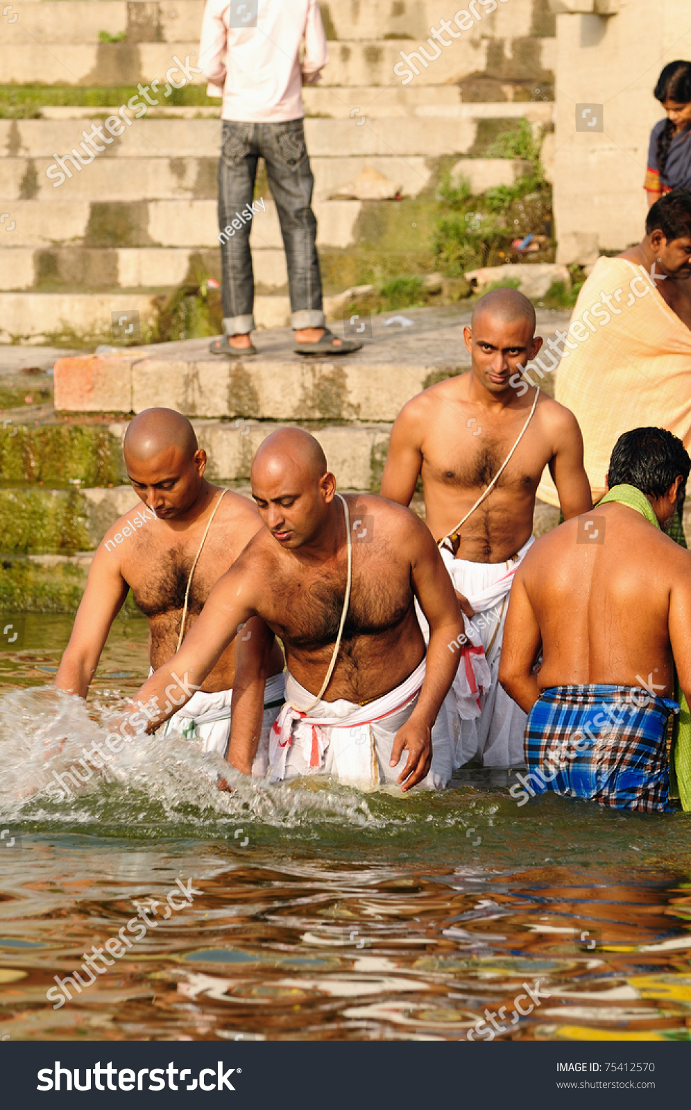 Stock photo varanasi india april unidentified hindu brahmin pilgrims take bath in the holy wat