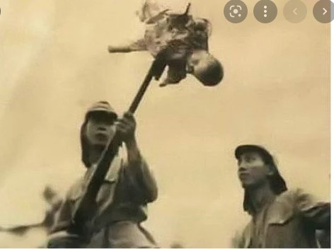 Japanese soldiers bayonetting some poor chinks
