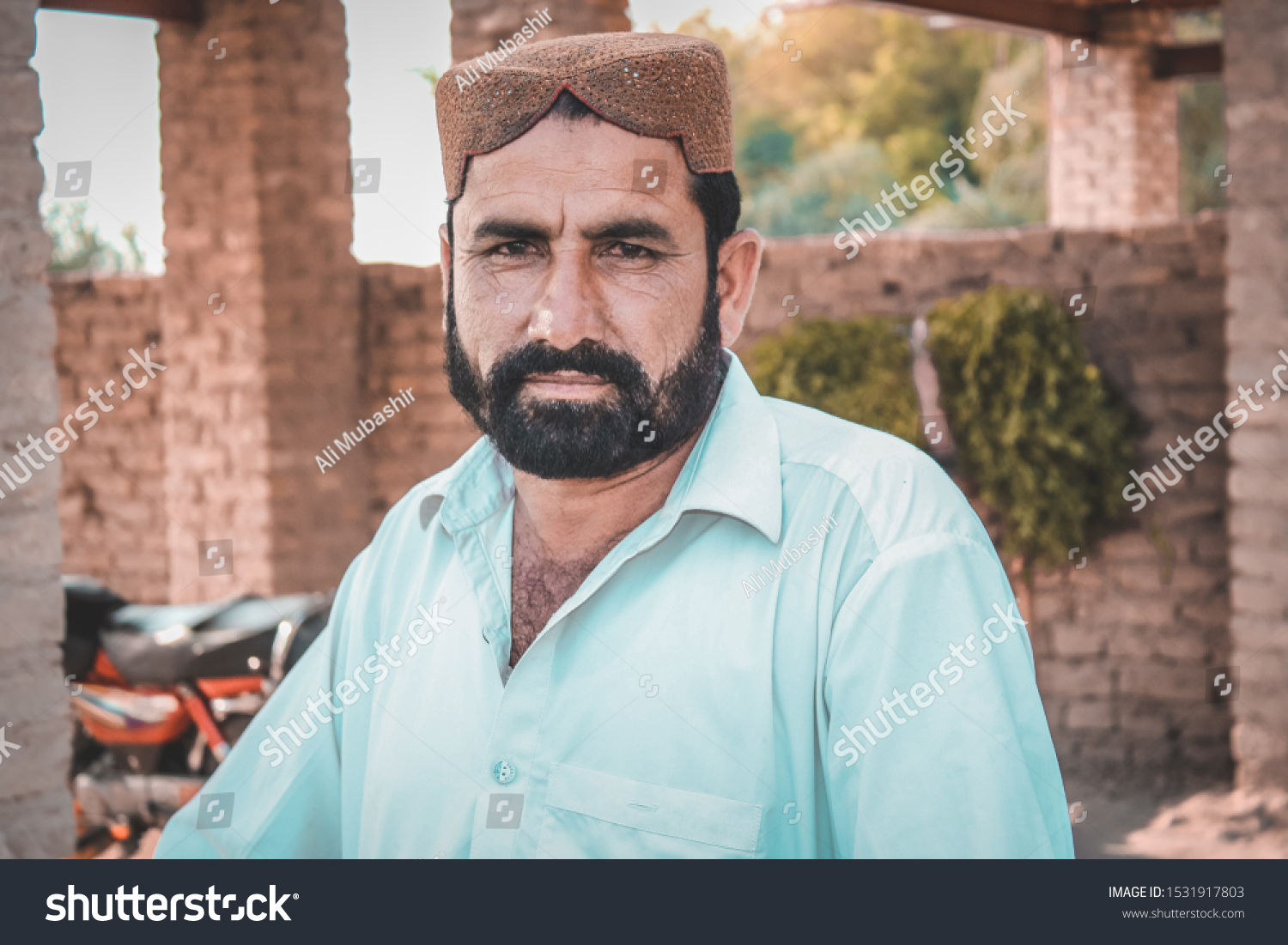 Stock photo a sindhi beard man with his traditional cap the cap called sindhi topi standing on