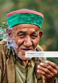 Daily Life In Himachal Pradesh Hindu Rajput man smoking a biddi (hand  rolled cigarette) in the village of