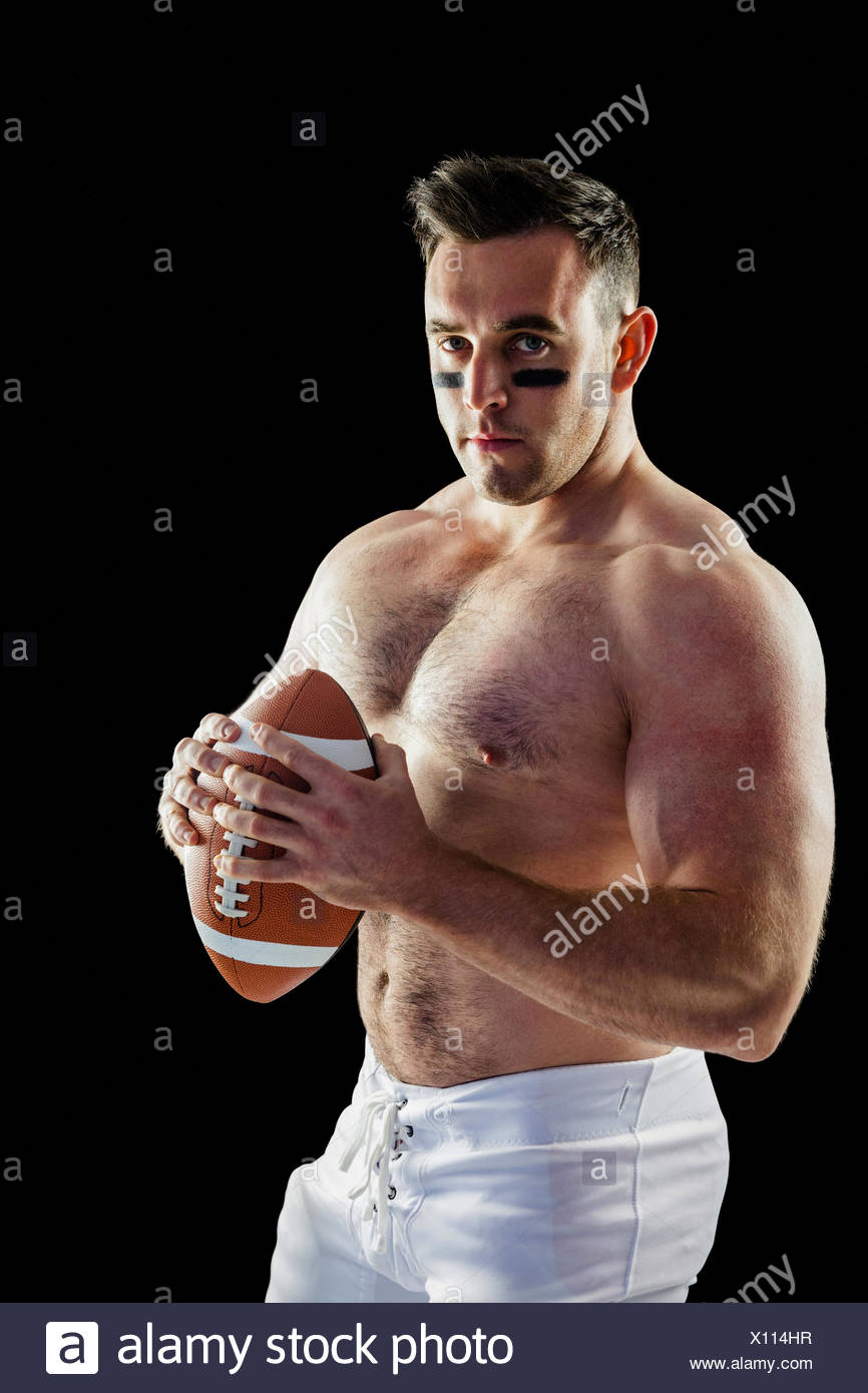 Shirtless american football player with ball X114HR