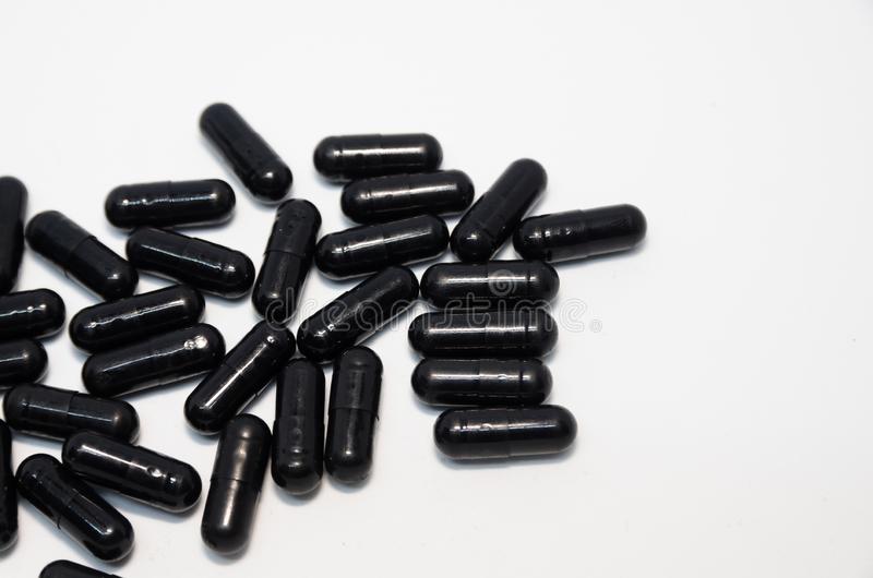 Medical black pills medical black pills copy space medicine concept isolated white background 