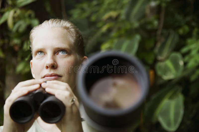 Pretty woman binoculars rain forest 5820494