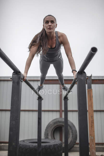 Focused 178126324 stock photo female athlete doing push ups