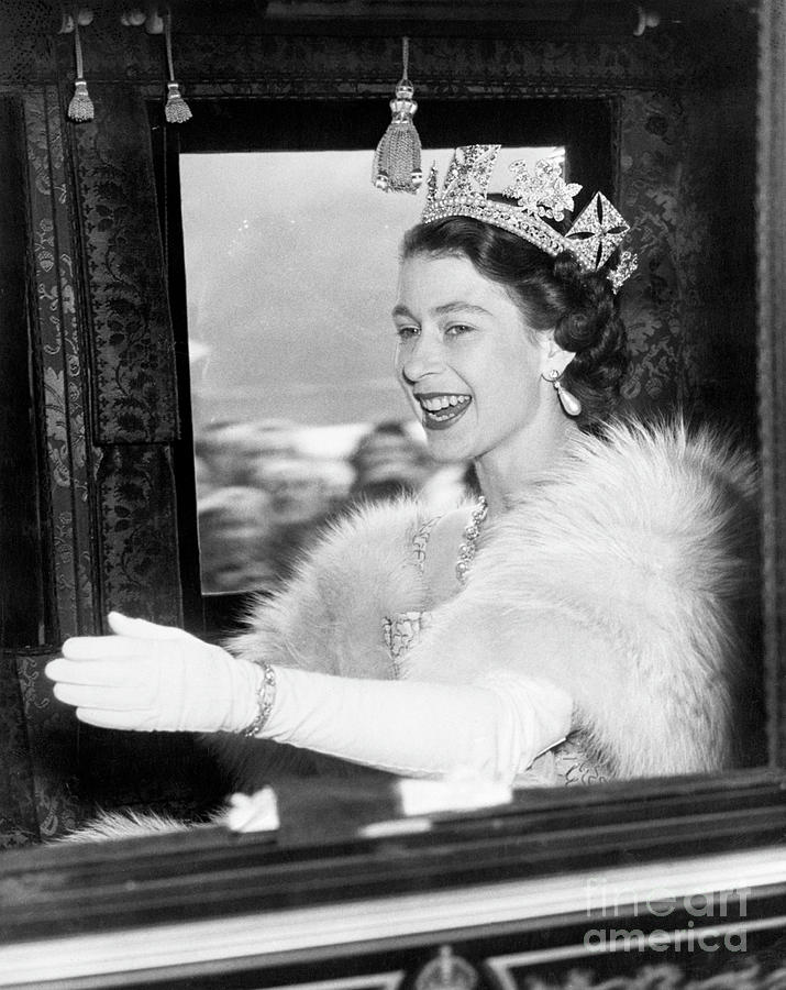 Queen elizabeth ii waving from coach bettmann