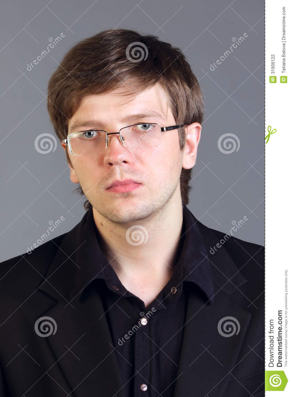 Handsome intelligent man close up portrait suit gray background 31906122