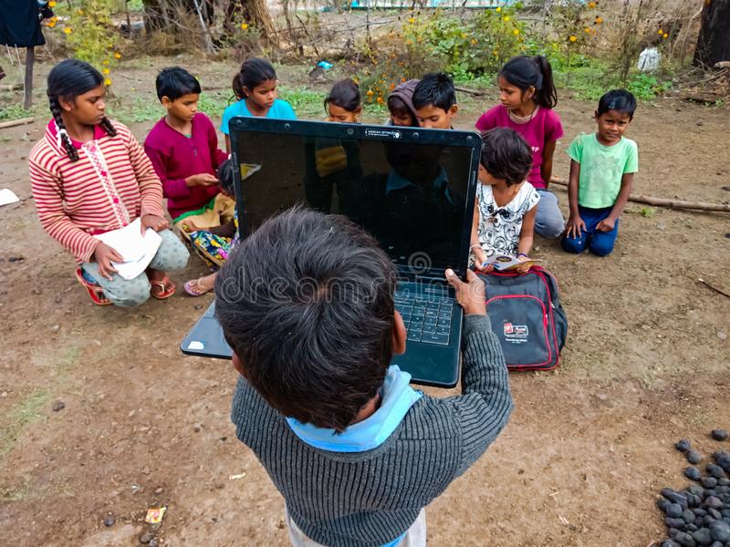 Indian village boy holded laptop computer open area class india january indian village boy hol