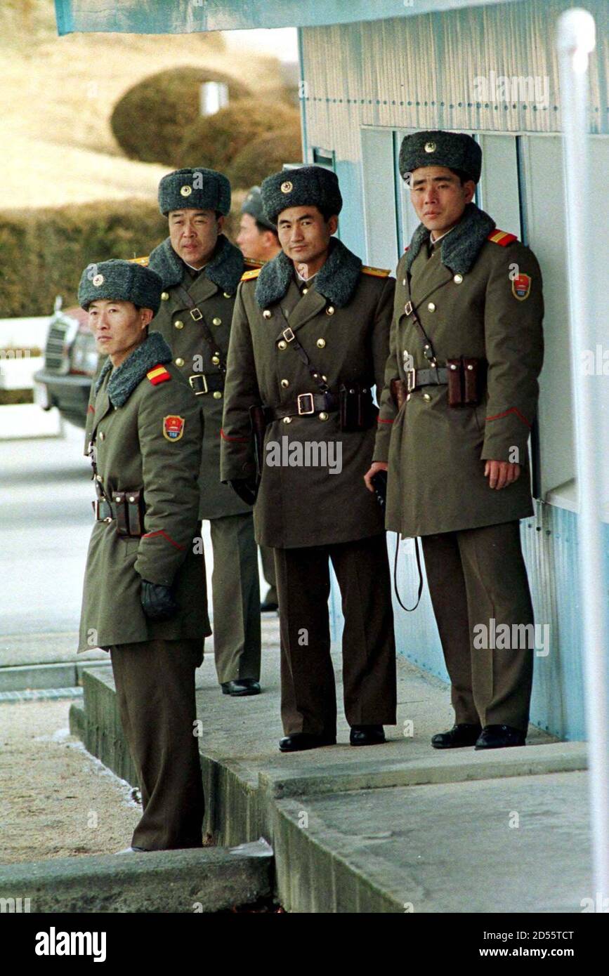 North korean soldiers look towards the south korean section of the korean peninsulas truce vil