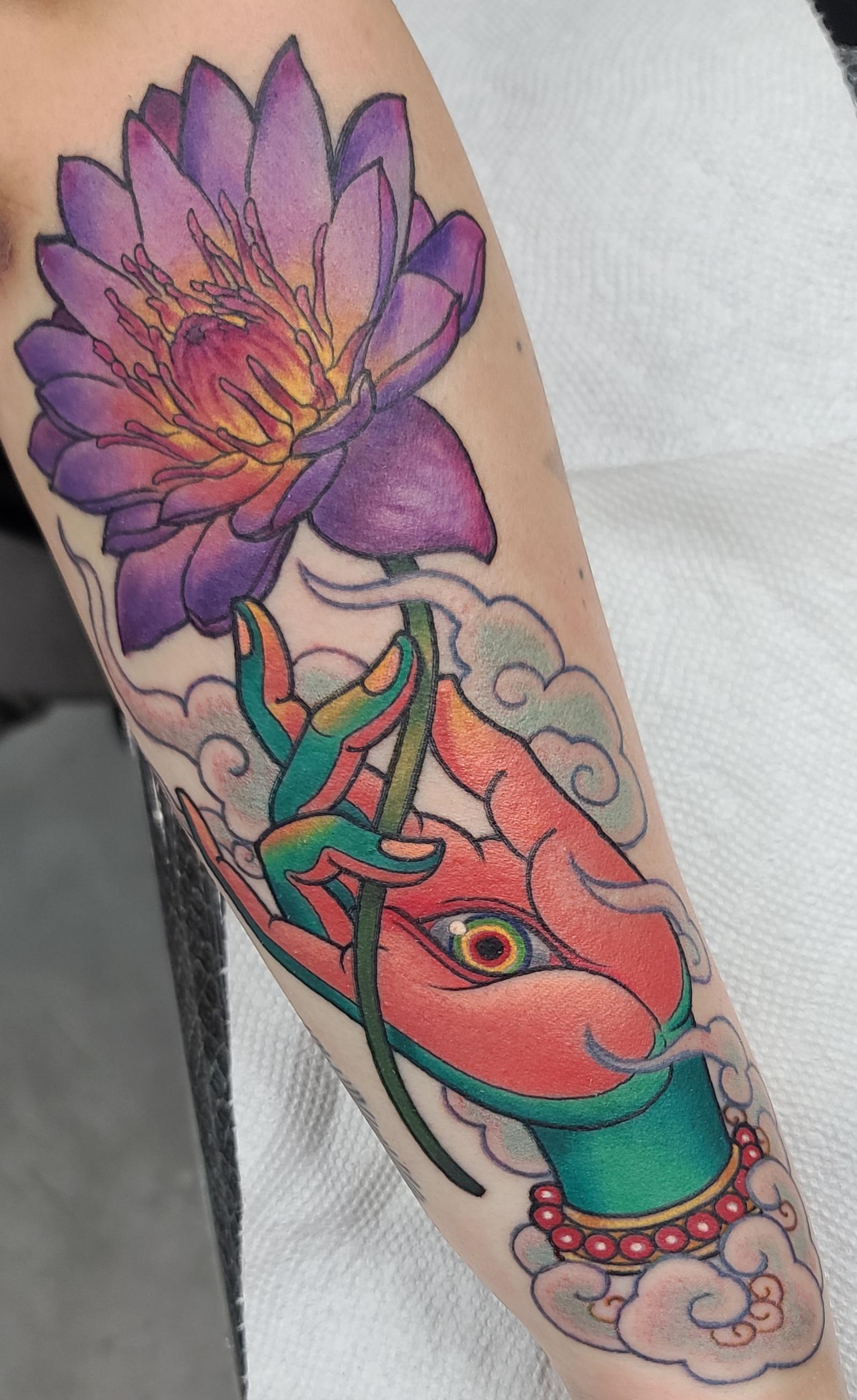 My green tara hand holding a lotus forearm tattoo by v0 4fq0f650g7s91