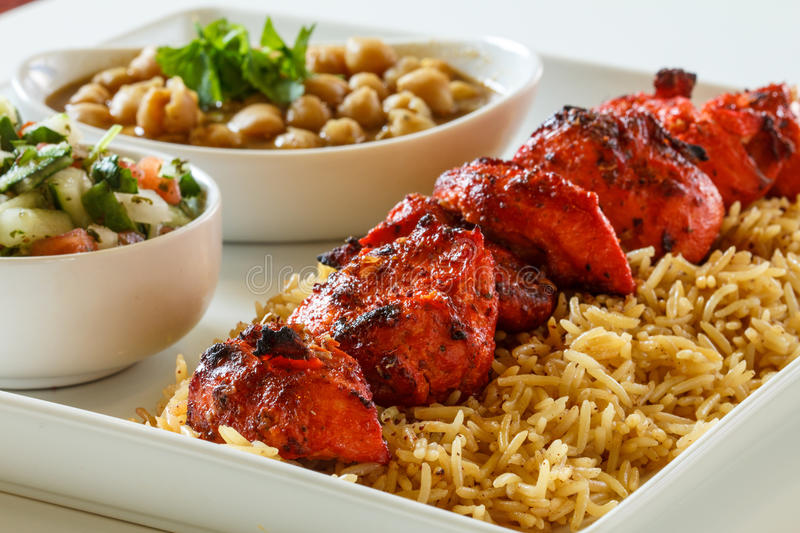 Chicken kabob dinner rice vegetables 97822412