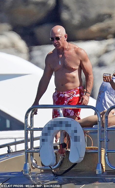 52222009-10344573-Bezos_wore_a_Hawaiian_inspired_red_and_pink_bathing_suit-a-1_1640473613363.jpg