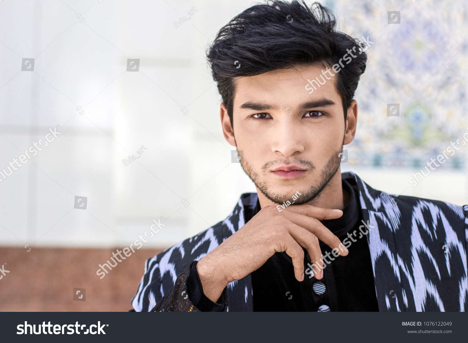 Stock photo handsome man portrait in central asia uzbek designed suit over mosque background 1
