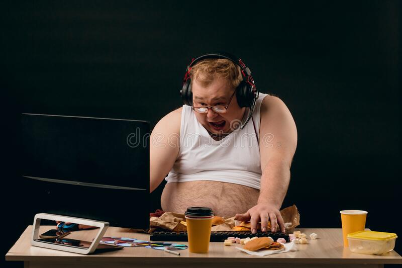 Emotional fat plump man listening to music using computer close up photo funny wasting his tim