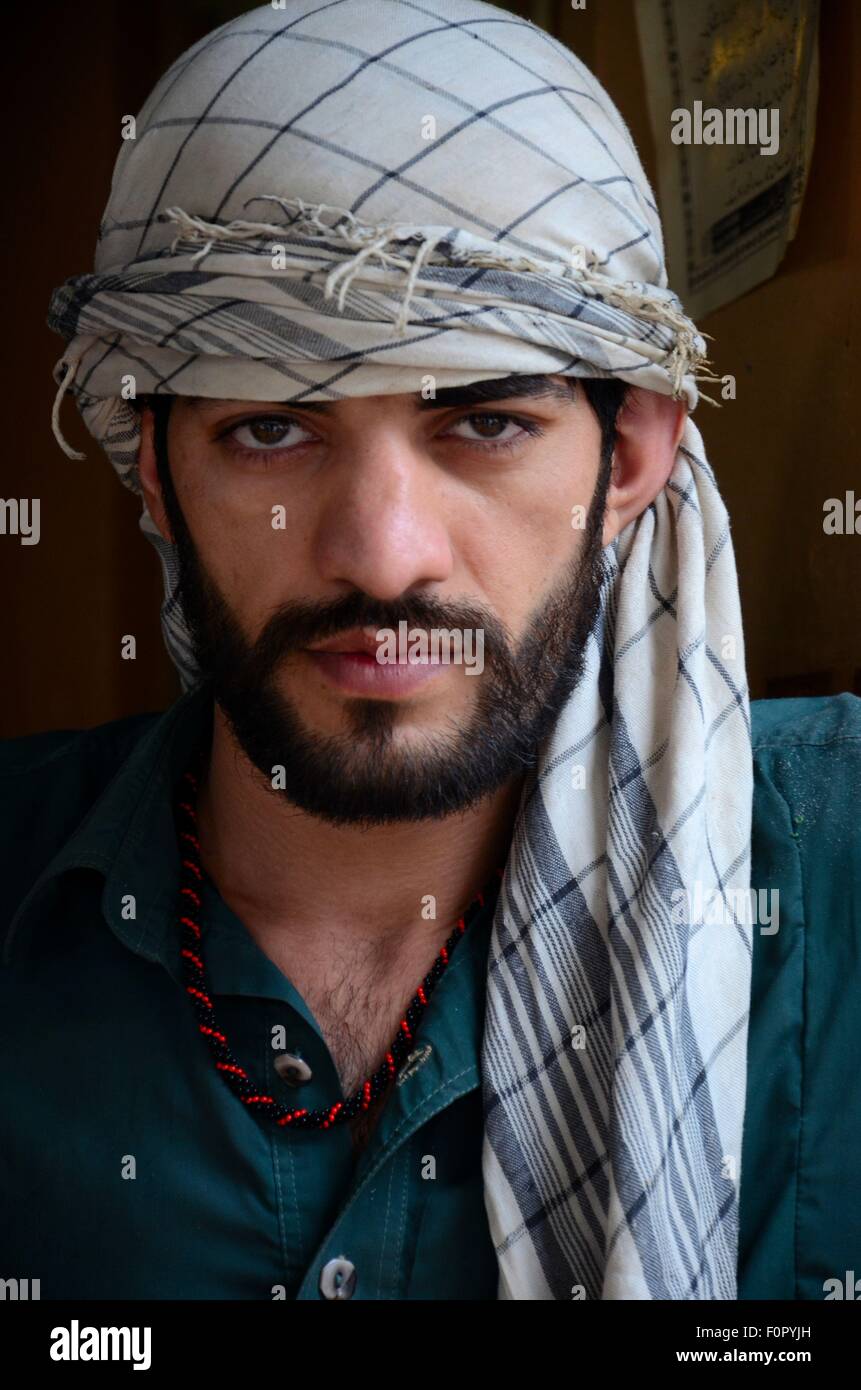 Pakistani pashtun man models with headscarf and necklace peshawar F0PYJH