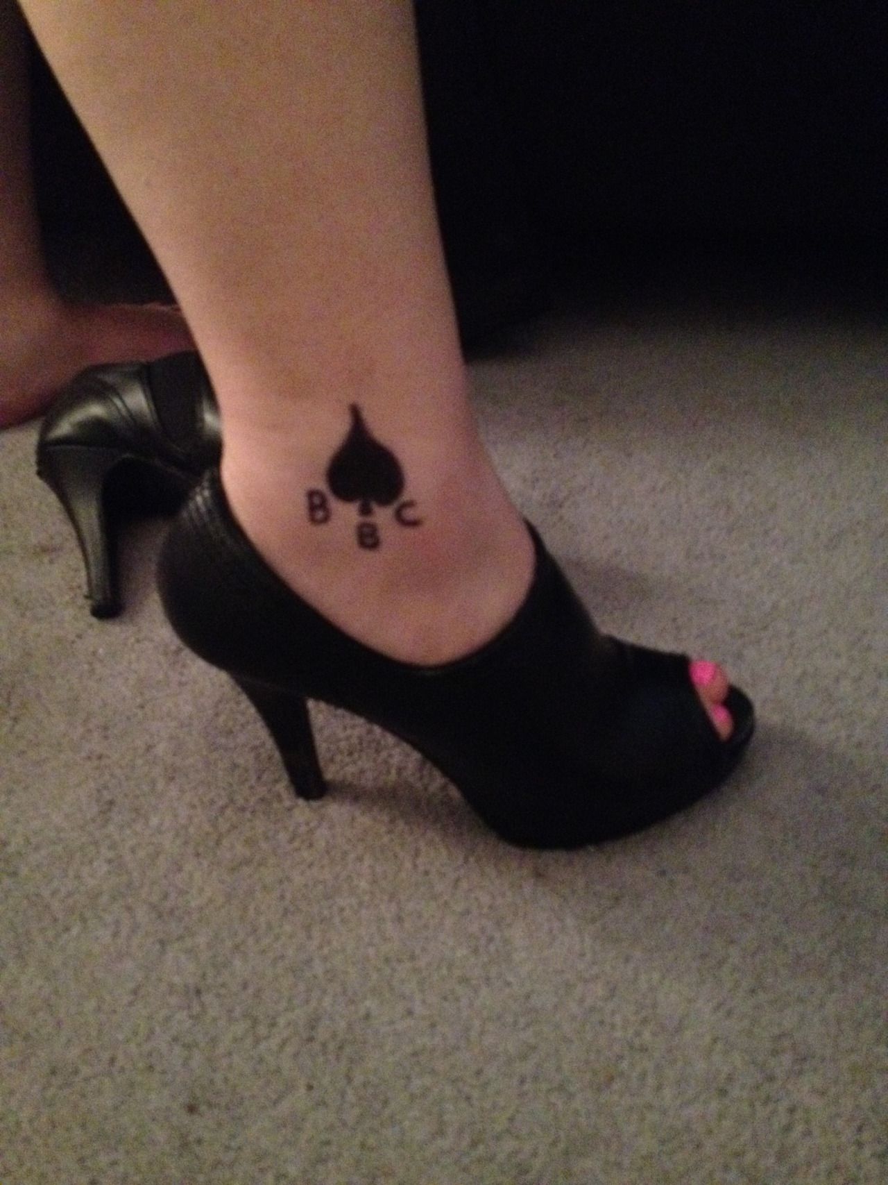 Actress with ace of spades tattoo on ankle