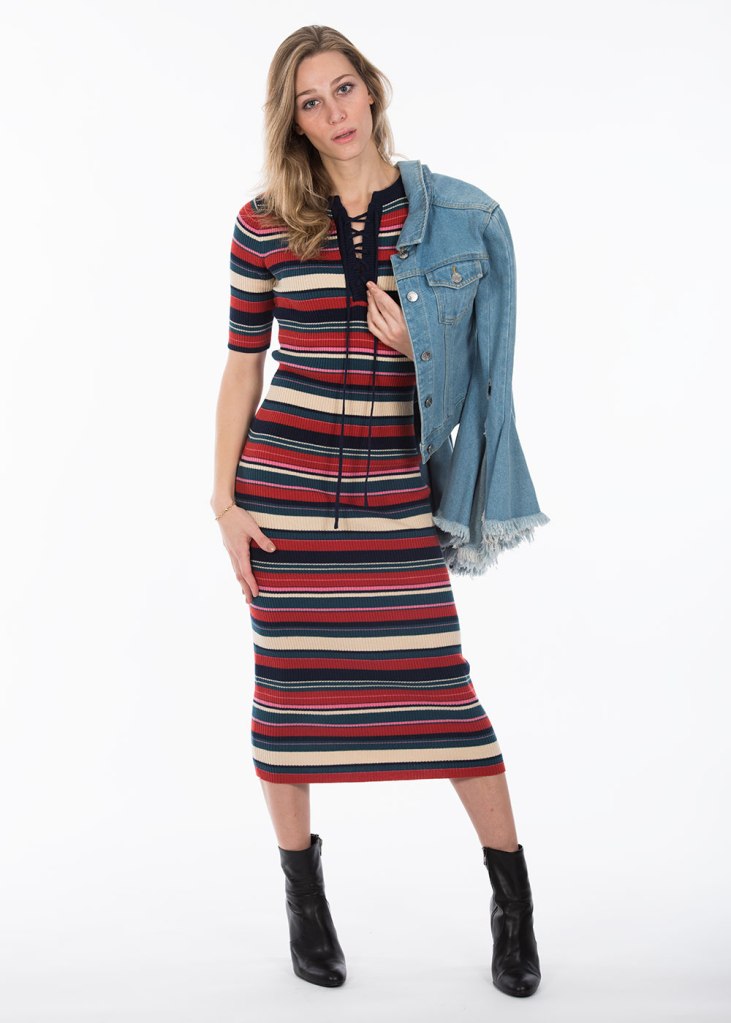 Woman in striped dress draped jacket