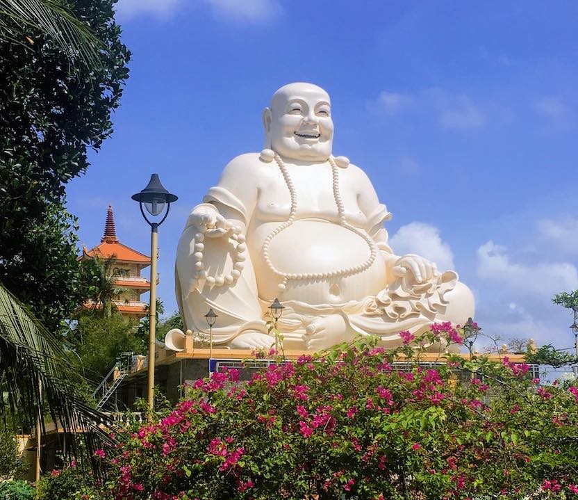 Skinny Buddha vs Fat Buddha in vinh Trang Temple in Vietnam