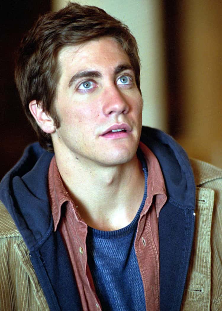 Young jake gyllenhaal in beige coat hoodie and buttondown shirt photo u1