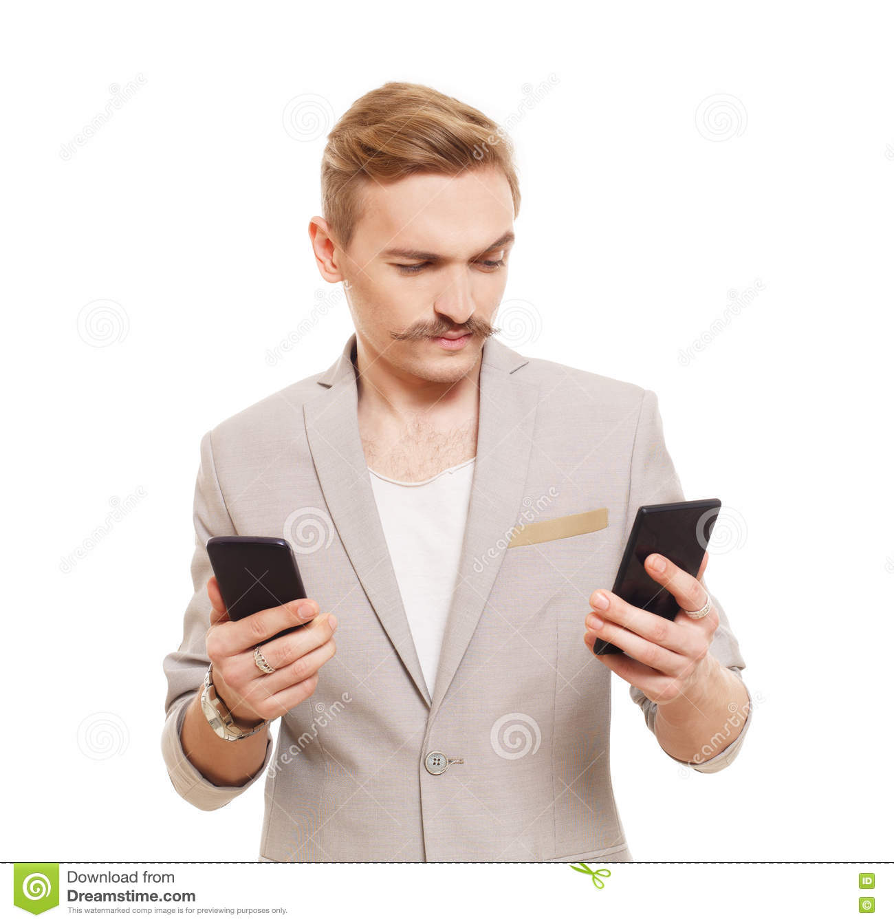 Young man holding two mobile phones make choice blond mustache choose cell guy looks selecting