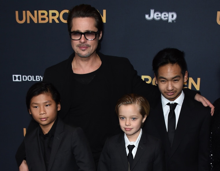 161107 brad pitt family mbe 1042p