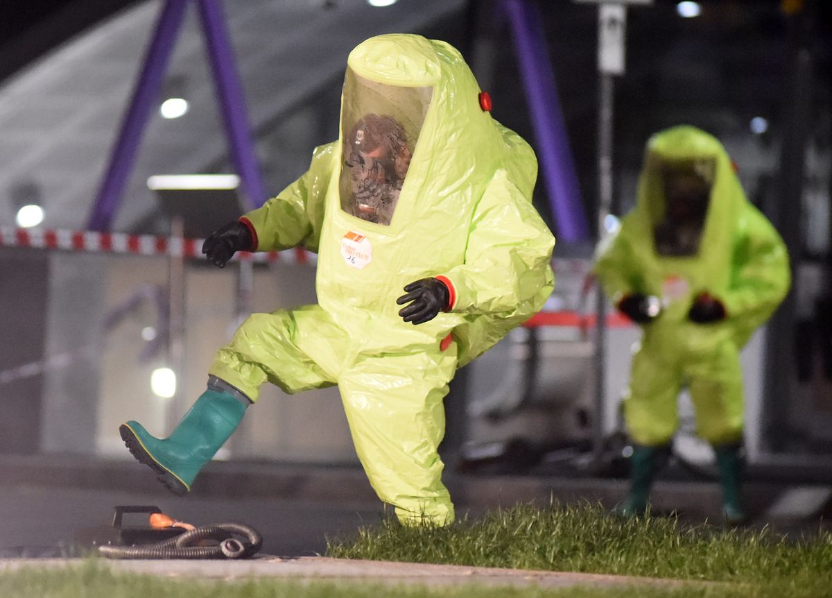 Firefighter wearing a hazmat suit takes part in the news photo 1575580700