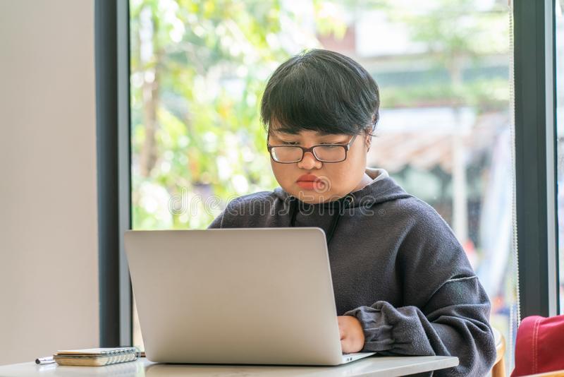Fat asian short hair woman working laptop fat asian short hair woman working her laptop 136264