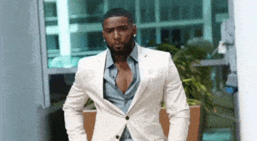 Black man white suit white suit