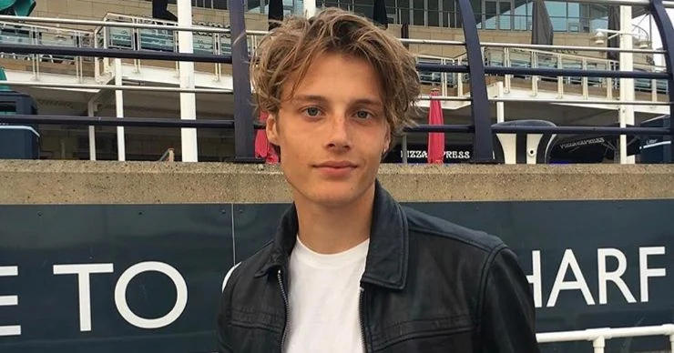 Hair man coat jacket apparel clothing face human person