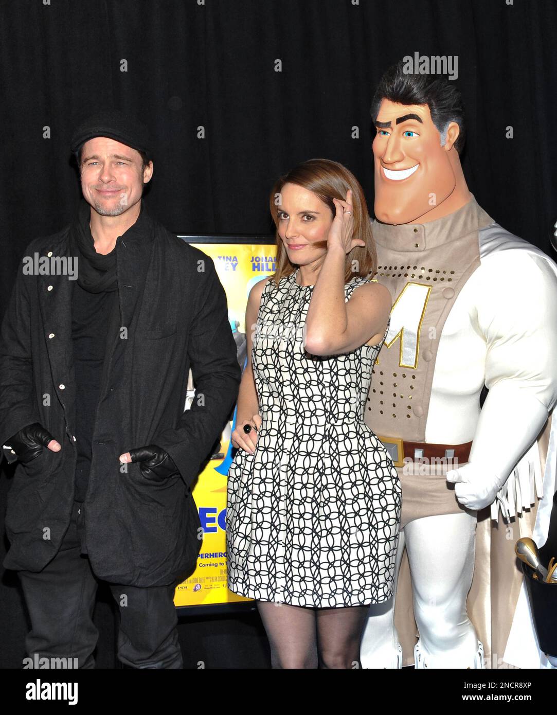 Actors brad pitt and tina fey pose with metro man at the megamind film premiere at on wednesda