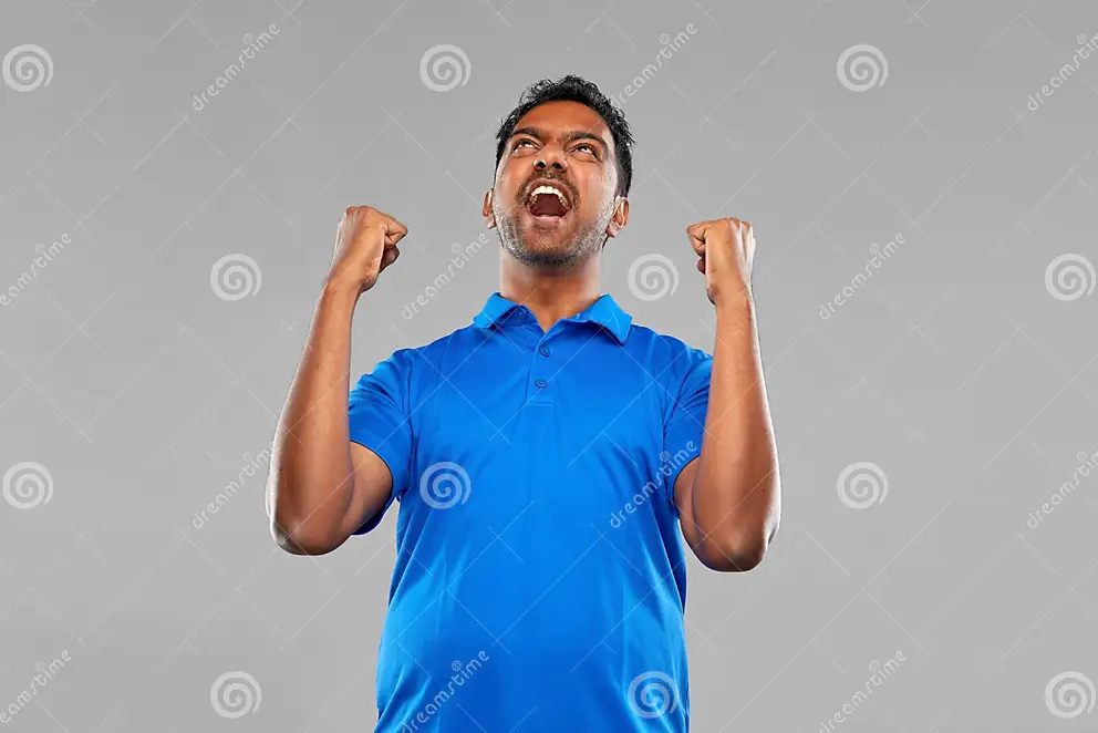 Success emotion expression concept happy young indian man celebrating victory over grey backgr