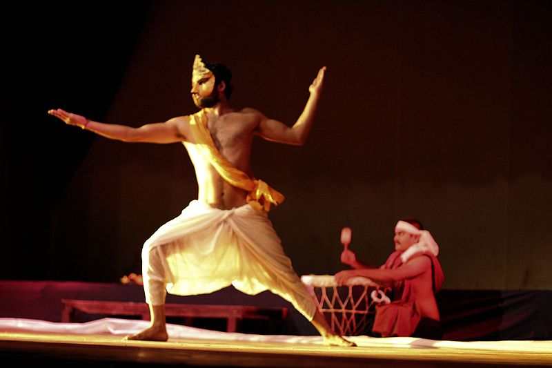 An Indian dancer in dhoti wrapped around his waist