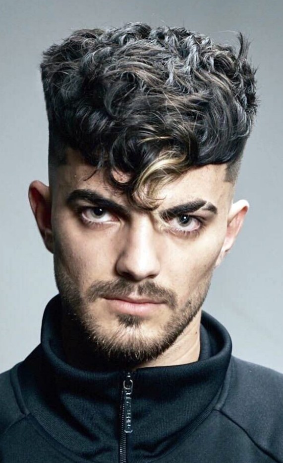 A high volume crop with elephant trunk is a bold statement if you have thick and wavy hair try