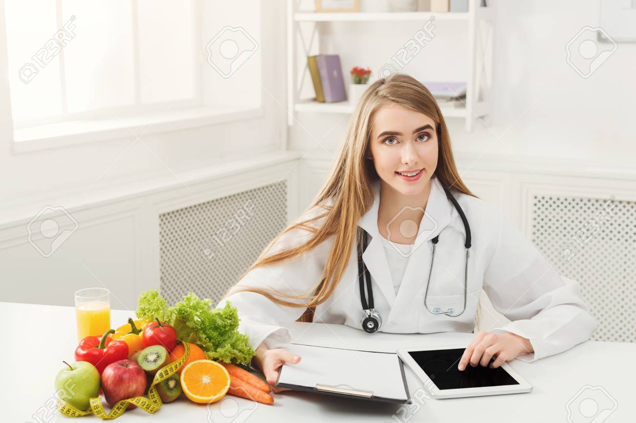93443347 female nutritionist working on digital tablet in office beautiful woman dietitian typ 93443347 female nutritionist working on digital tablet in office beautiful woman dietitian typ