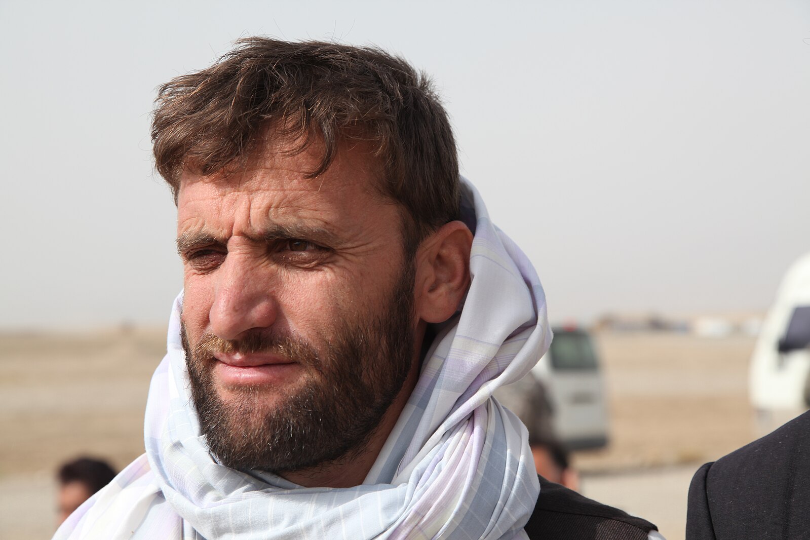An Afghan man waits by the flight line at Forward Operating Base Shank in Logar province Afgh