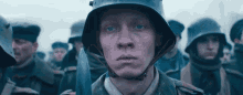 Paul bumer looking broken as he stares ahead to the battlefield all quiet on the western front