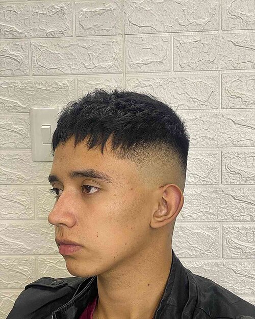 High fade french short haircut with choppy bangs for guys