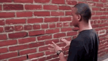 Guy talking to brick wall fast talking