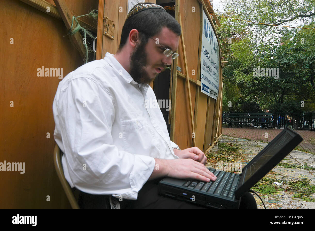 New york ny jews mark sukkoh a man with laptop computer outside the CX7J45