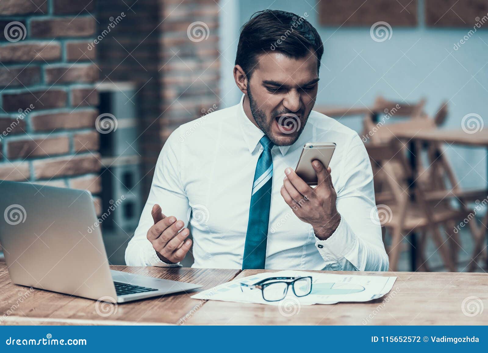 Angry indian businessman screaming phone office angry indian businessman screaming phone offic