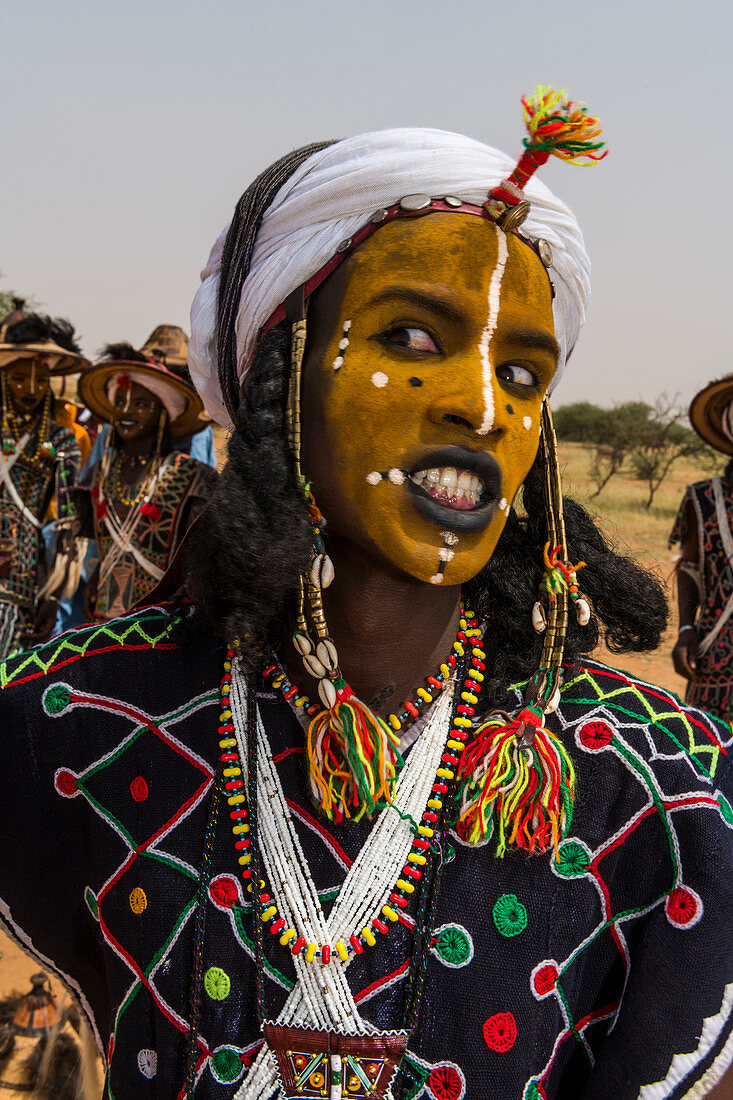 71352321 Wodaabe Bororo man with face painted at the annual Gerewol festival courtship ritual 