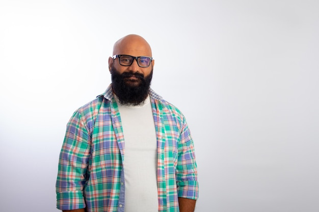 Indian bald man wearing casual clothes glasses looking camera smiling 156779 677
