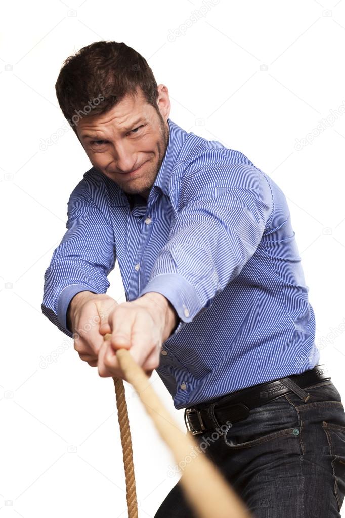 Depositphotos 20922017 stock photo man pulling rope