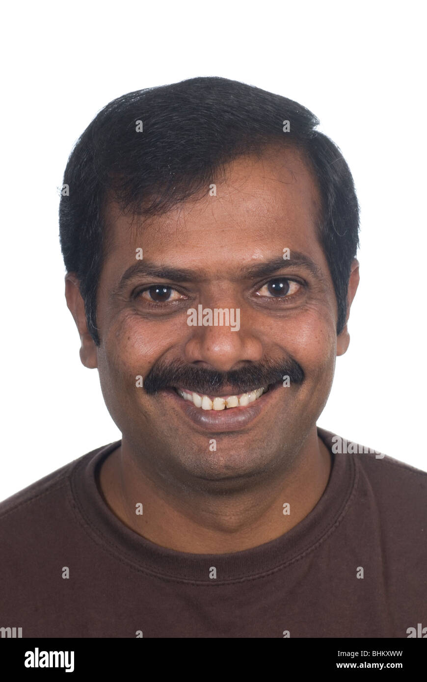 Happy indian man smiling against a white background BHKXWW