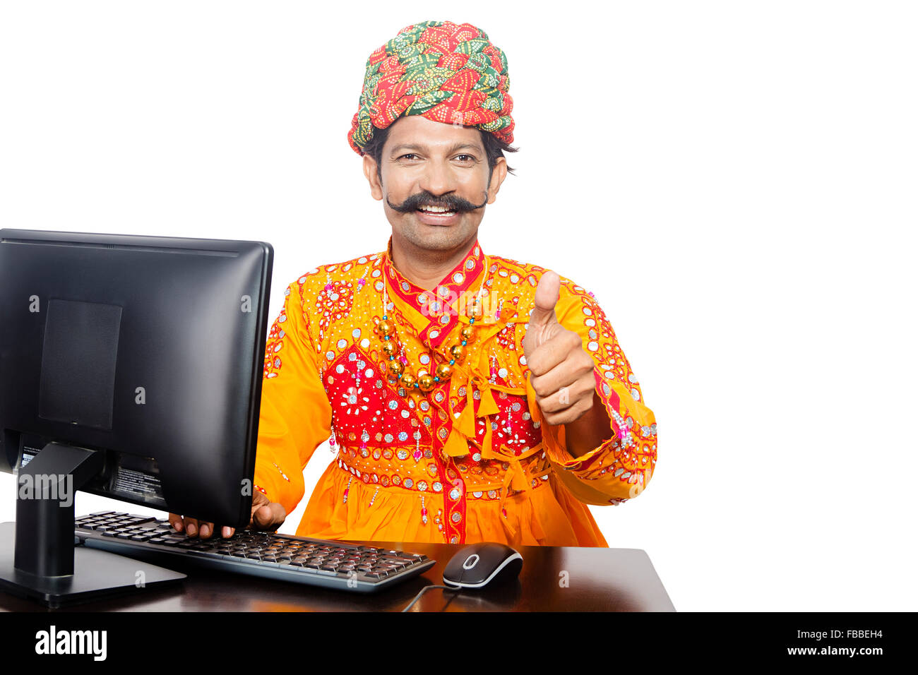 1 indian rural gujrati man computer education and thumbs up showing FBBEH4