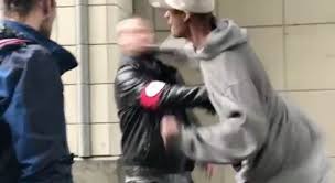 Swastika-wearing man punched on Seattle ... Swastika-wearing man punched on Seattle ...