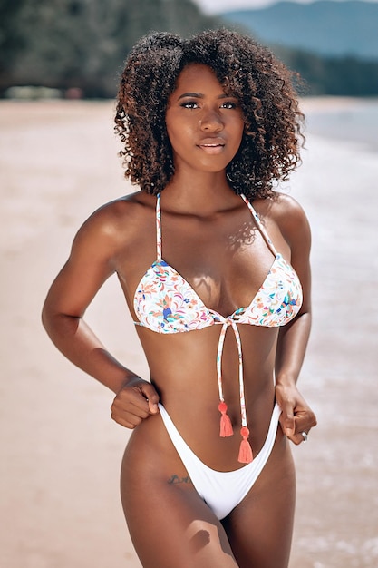 Image beautiful young afro american woman colorful swimwear staying posing camera beach photo 