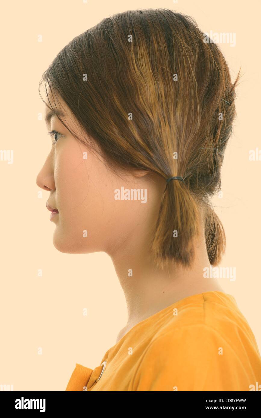 5832037 profile view of face of young beautiful asian woman 2D8YEWW